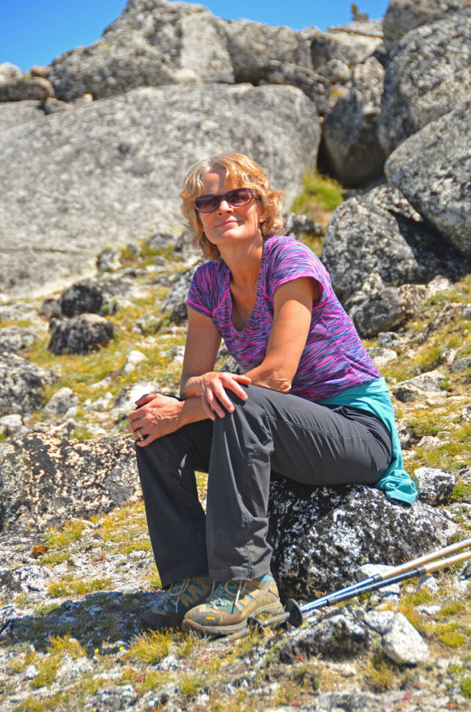 Mary resting on a granite boulder